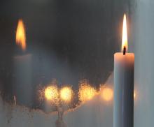 December 2020 photo writing prompt (white taper candle burning in front of its window reflection)