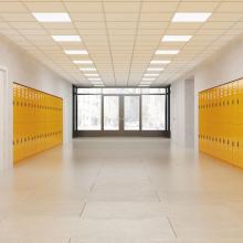 a brightly lit school hallways with large picture window at one end and lined with yellow lockers, via Canva