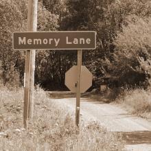 sepia photo of a road sign that says Memory Lane via Canva